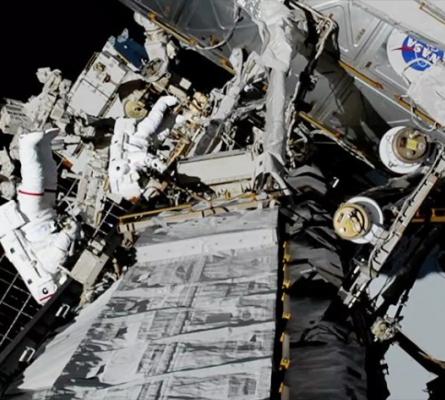 Astronauts Christina Koch and Jessica Meir spacewalk outside the International Space Station