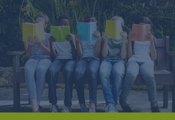 5 children sitting on a bench each reading a book with a different solid colored cover