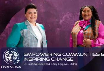 Empowering Communities and Inspiring Change. Two people in brightly colored suits in front of a purple background