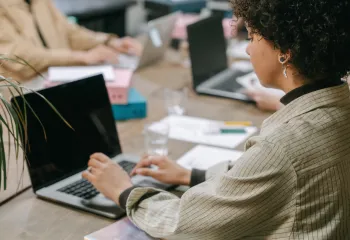 Woman typing on a laptop