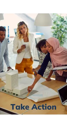 Diverse group of people looking at a building model