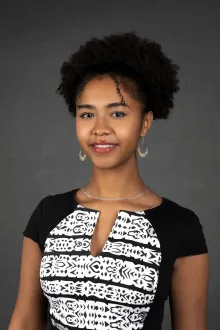 Jamora Arroyo Jefferson - young woman with curly black hair wearing black and white top