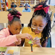 two black girls doing an experiment