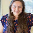 Dieuwertje Kast - woman with log brown hair wearing navy shirt with orange dinosaurs