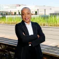 Photo of Gloria Blackwell - woman with short, gray and black hair wearing black blazer and white shirt