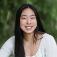 Alyssa H - teen girl with long, black hair wearing a white sweater